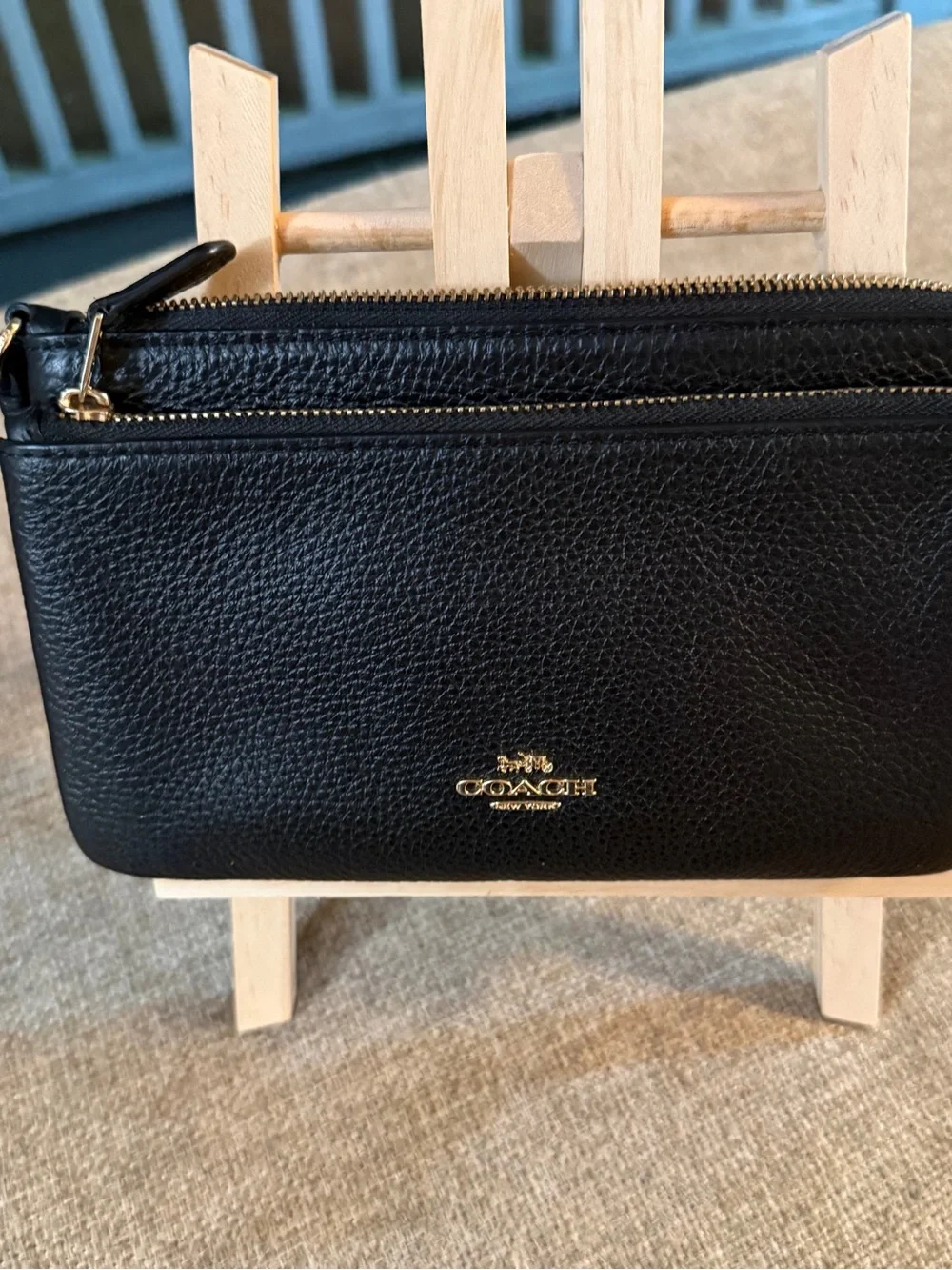 Coach Double Zip Wristlet crafted in black pebbled leather